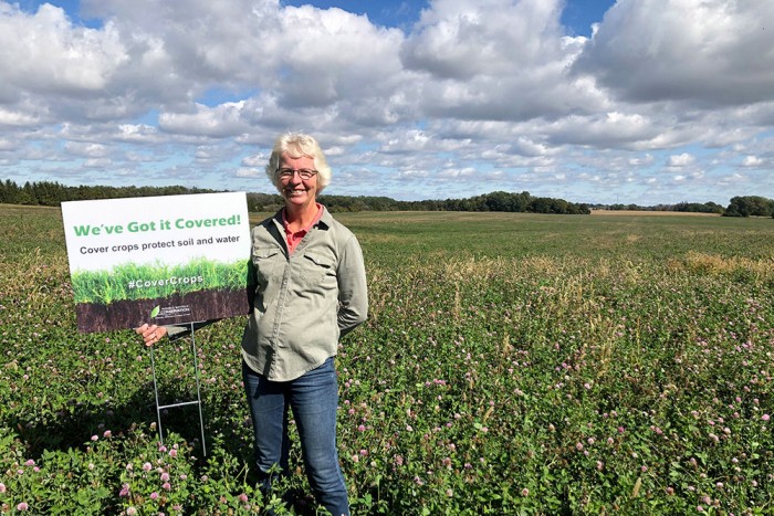 SIGNS RECOGNIZE COVER CROP PLANTING BENEFITS â€“ Margaret Kroes, who farms with her husband, Jack, near Clinton, Ontario, is one of the local agricultural producers planting cover crops. Here, Margaret stands beside a new â€˜Weâ€™ve Got it Covered!â€™ sign.